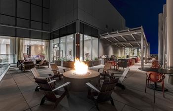 Panoramic sky deck featuring gourmet grills, elegant fire pits, and resort style lounge seating